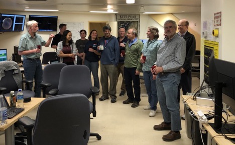 A group of researchers congratulating the award recipient.