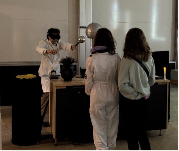 Volunteers demonstrate mystifying exhibits at the House of Illusions 2025 debut